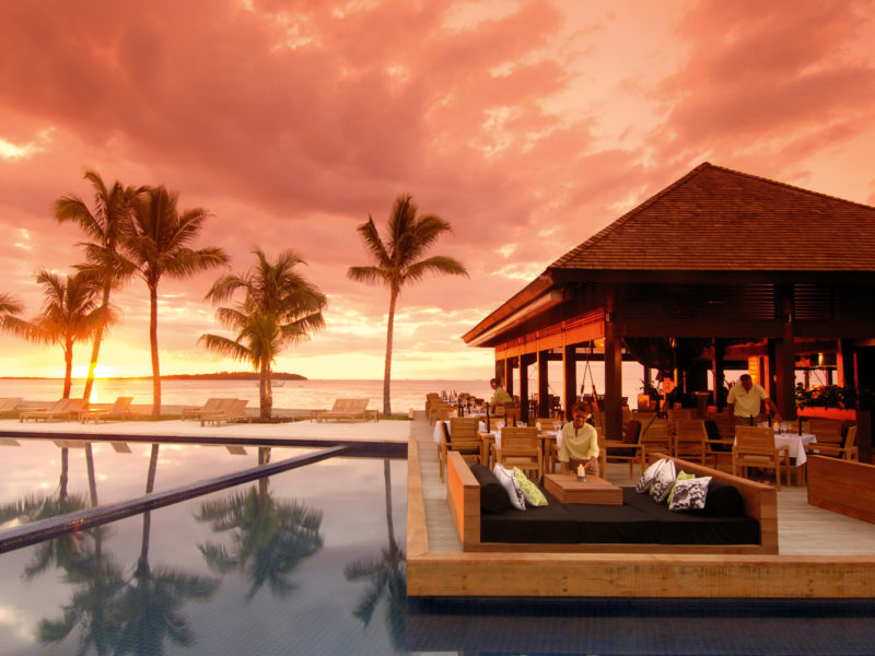 Sunset drinks by the resort pool.