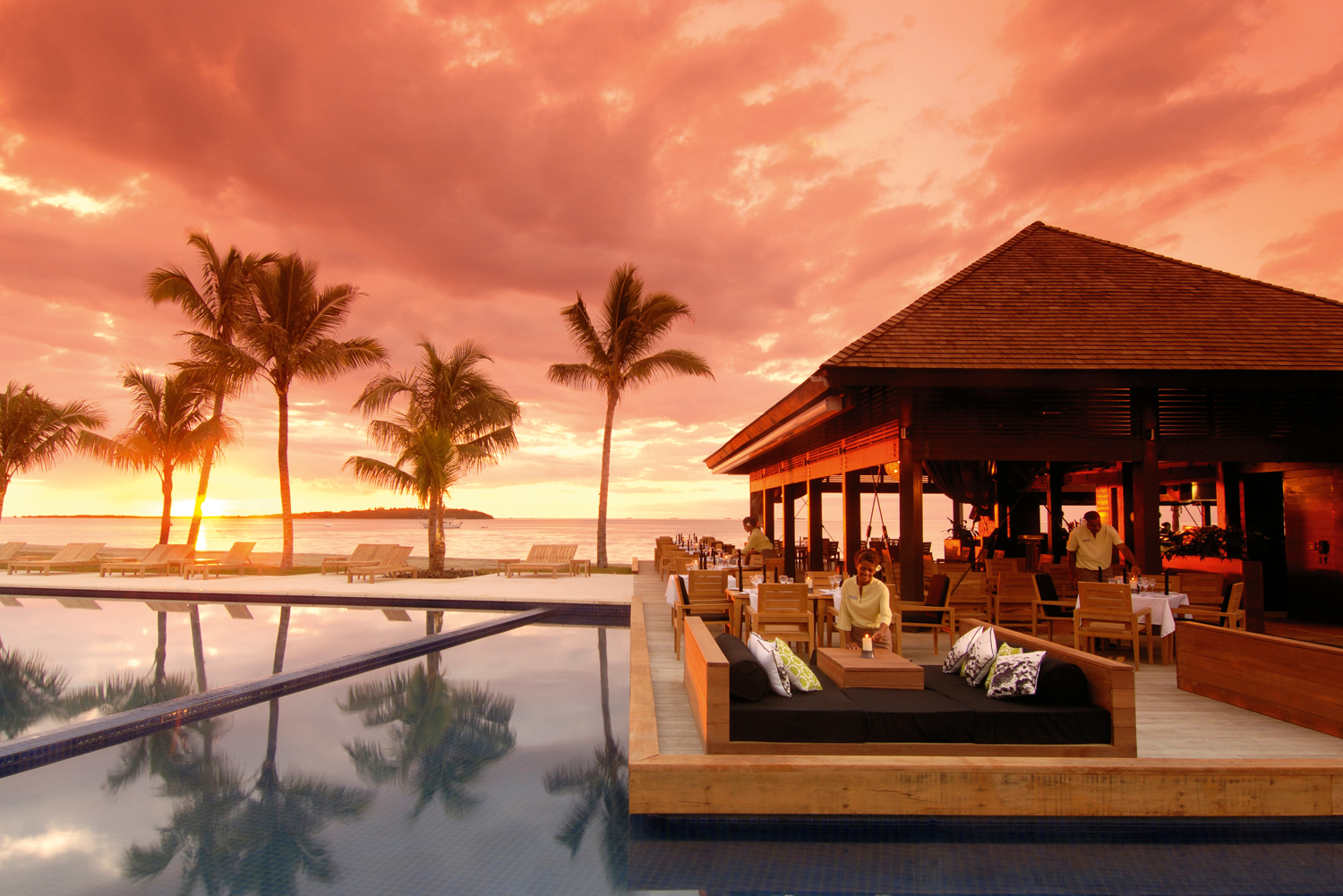 Sunset drinks by the resort pool.