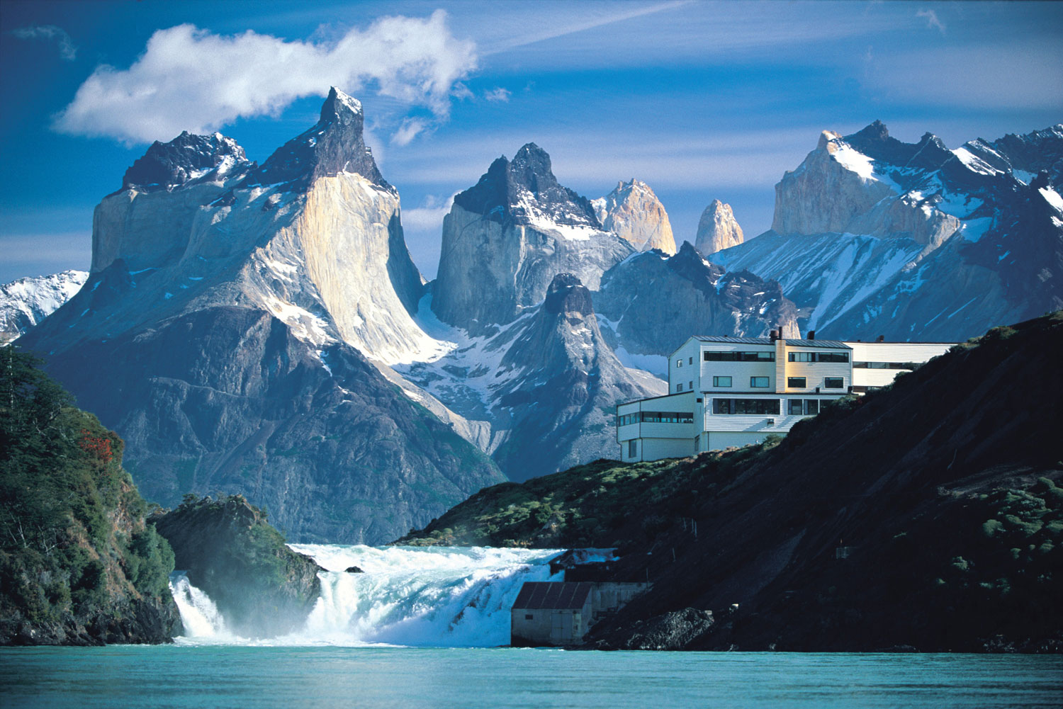Explora Salto Chico hotel, overlooking Lake Pehoé, the Salto Chico waterfall and the Torres del Paine range.
