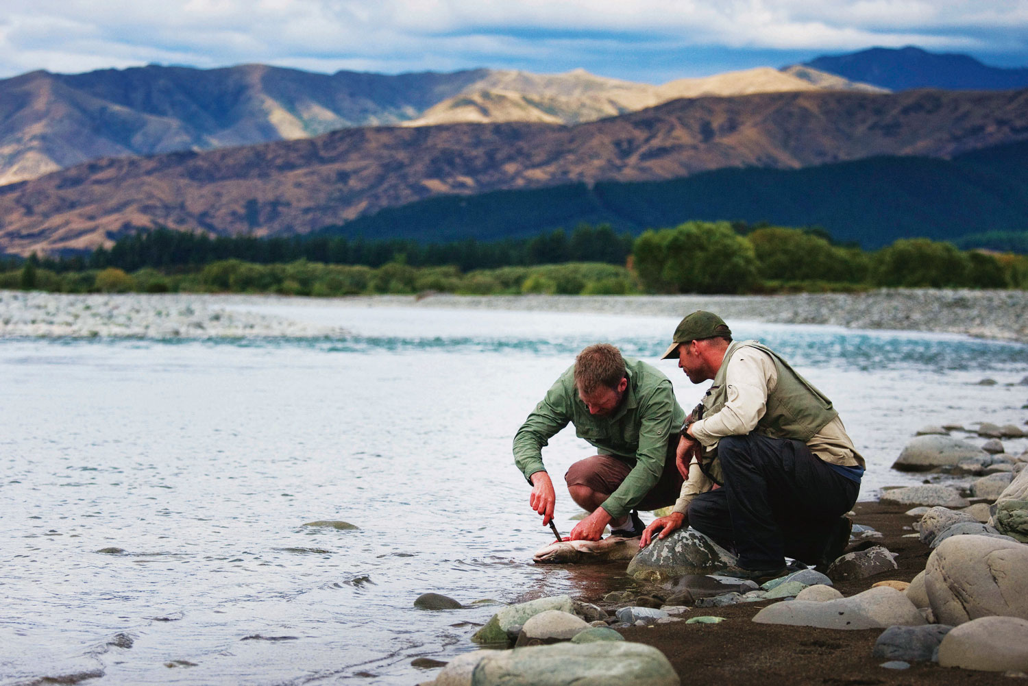 Fishing for trout in Wairau River, Marlborough.