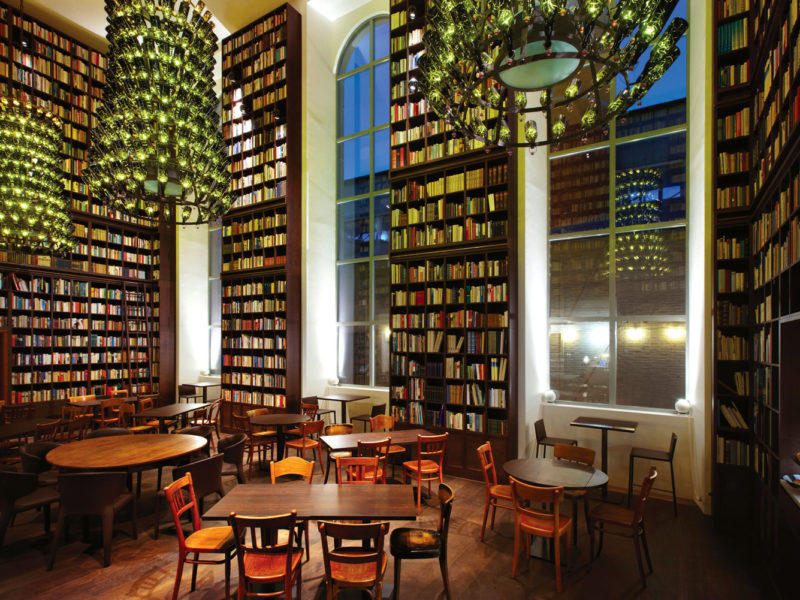 B2's bookish lobby features glass bottle chandeliers.