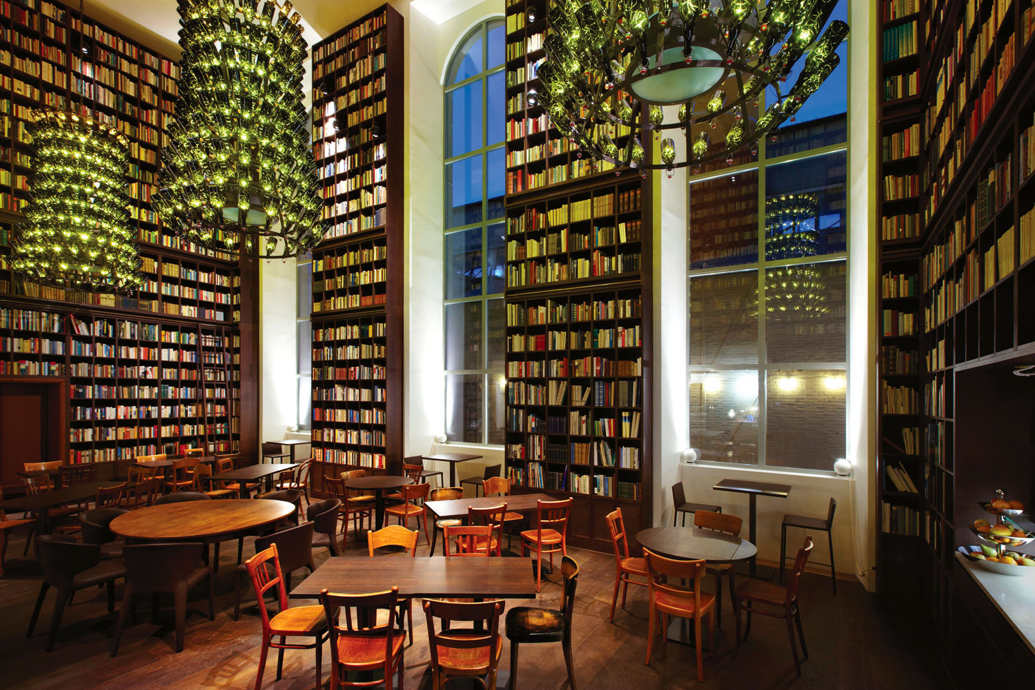 B2's bookish lobby features glass bottle chandeliers.