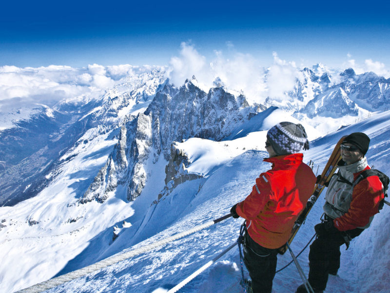 Skiers enjoying the view from Mont Blanc, France.