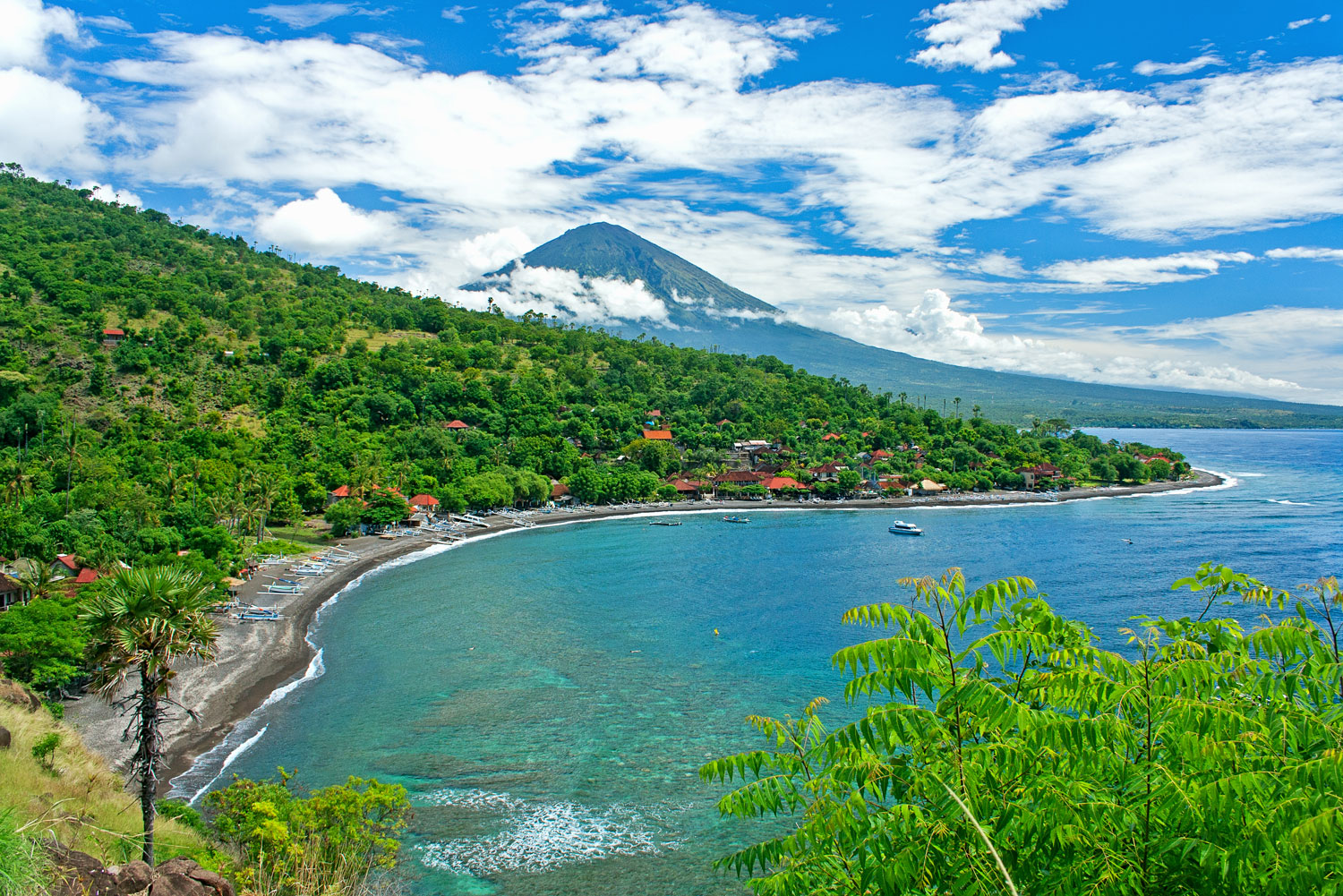 Amed in Bali's northeast, with Agung volcano in the background.