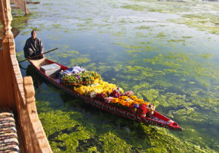 A flower seller on Kashmir's Nagin Lake.