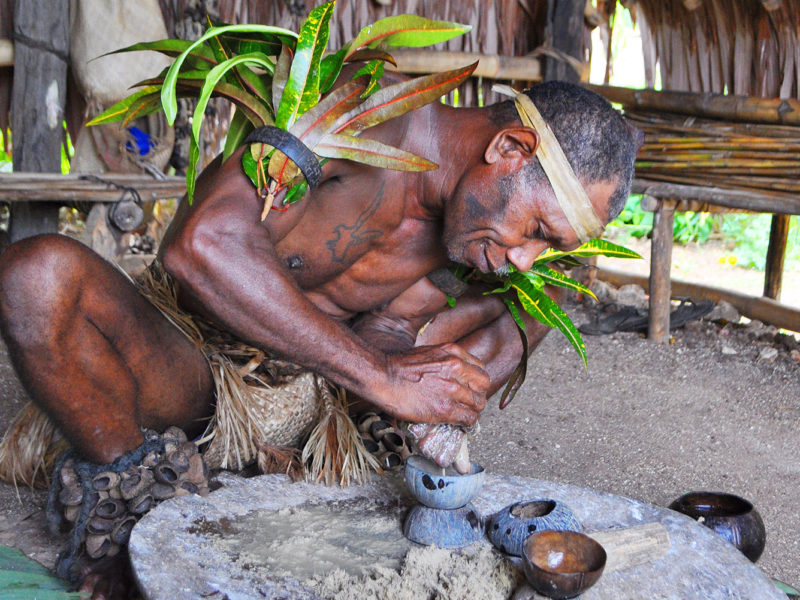 Chief making kava at Leweton Cultural Village, Vanuatu.
