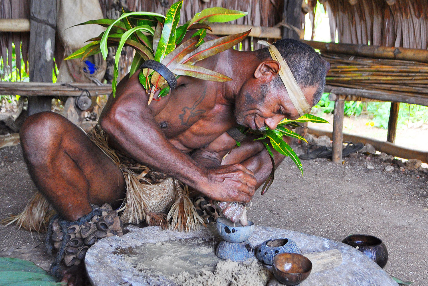 Chief making kava at Leweton Cultural Village, Vanuatu.