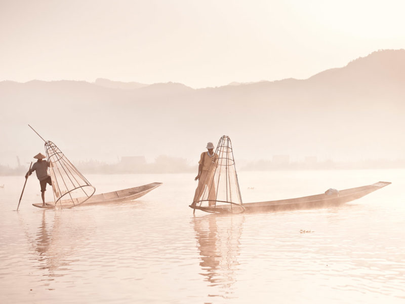 First light hits Inle Lake and the cone-fishermen start their working day.