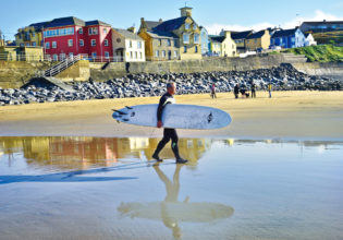 American surfer Shawn Hickey heading out for one of his first rides in Ireland at Lahinch.