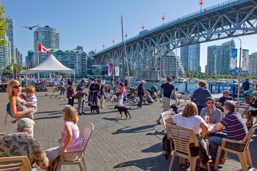 Victoria Visitors eating drinking and enjoying the sunshine on Granville Island by iStock_45576432