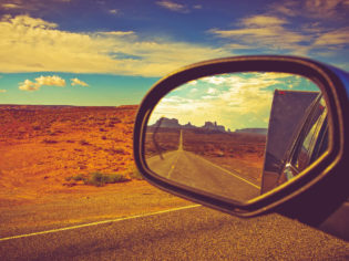 Reflection of road in car side mirror