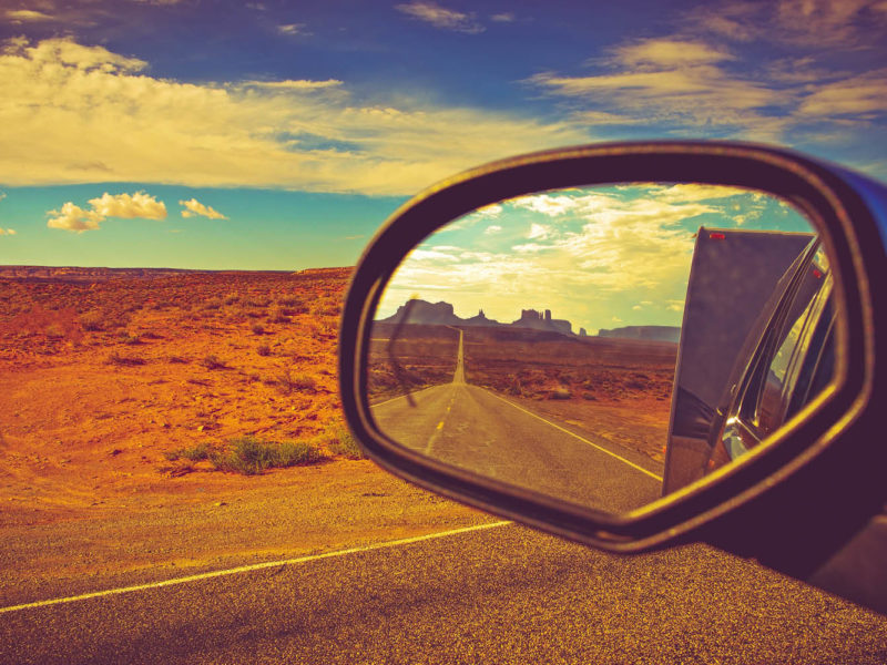 Reflection of road in car side mirror