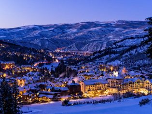 Beaver Creek Resort Winter Skiing at Dusk - Scenic view of village illuminated at night with ski runs.