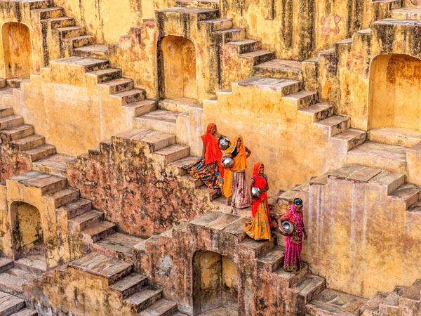 Women carrying water from stepwell near Jaipur, one of the stops on India's Golden Triangle.