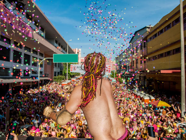 Man throwing confetti at Carnival