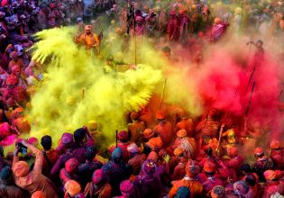 People celebrating in colour at the Holi Festival