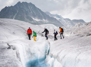 Hikers in the Great Aletsch Glacier, Swiss Alps, Switzerland