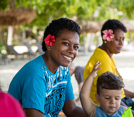 Outrigger Castaway employee and child, Fiji