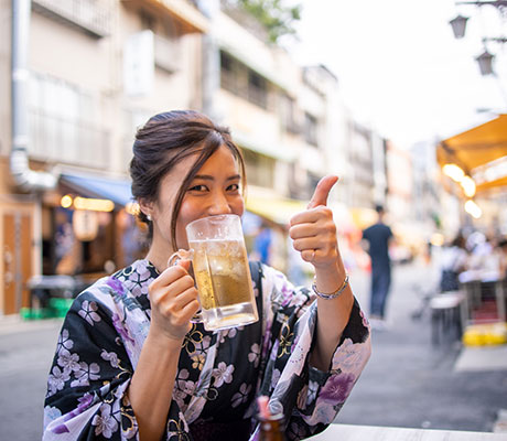 Woman drinking beer, Japan
