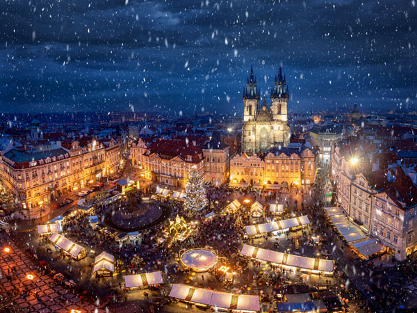 snowing in the Prague Old Town Square at night