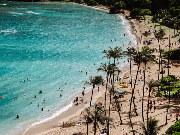 Swimmers on a beach in Hawaii