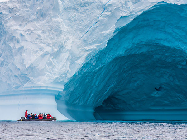 Boat in front of a glacier, Antartica Expedition