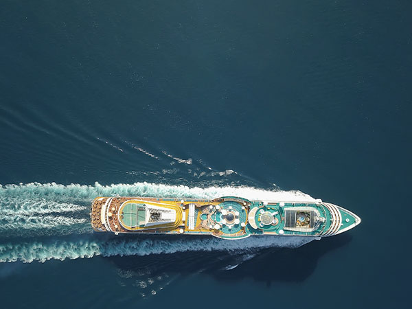 Aerial view large cruise ship at sea, Passenger cruise ship vessel, sailing across the Ksamil, Albania. View from drone.