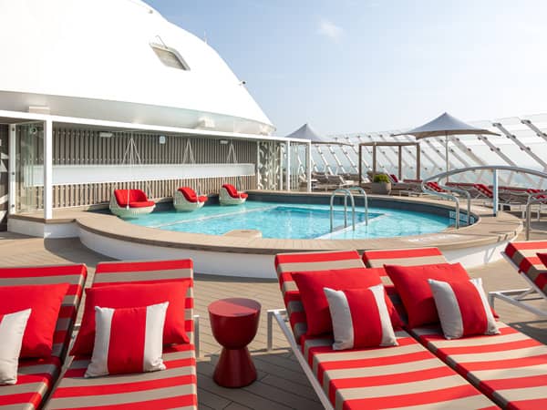 The two-level Retreat sundeck with secluded cabanas, chic seating and water features. The Retreat is an exclusive resort space for suite guests designed by Kelly Hoppen. (Image: Celebrity Cruises)