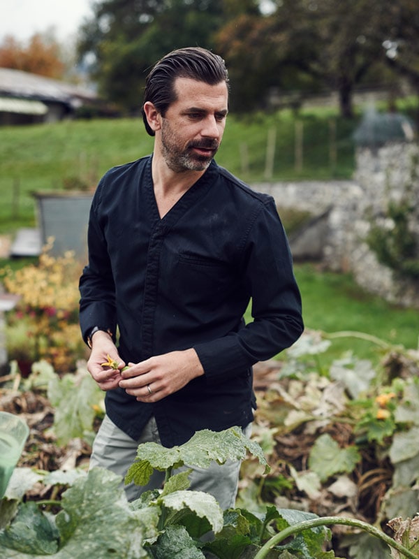 Andreas Caminada in his castle garden. (Image: Schloss Schauenstein)