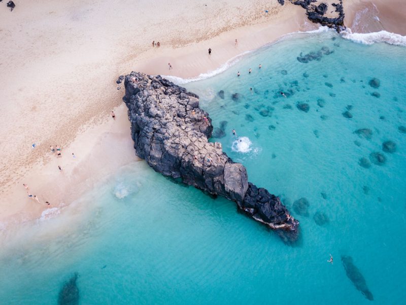 Cliff jumping in Waimea Bay Oahu Hawaii