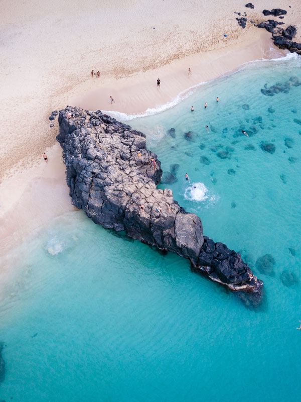 Cliff jumping in Waimea Bay