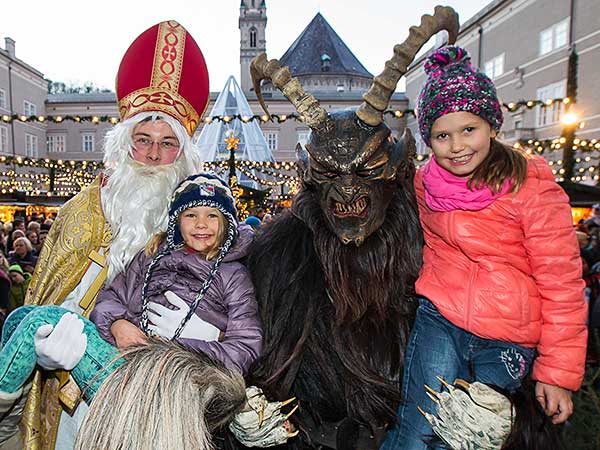 children with Krampus and St Nicolaus, Salzburg, Austria
