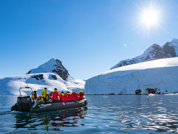 A group on a boat in Chiriguana Bay in Antarctica