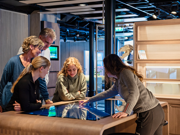 A group of people in the Science Center on Hurtigruten ships