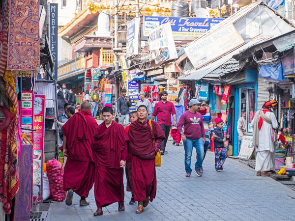 monks walking along McLeod Ganj streets