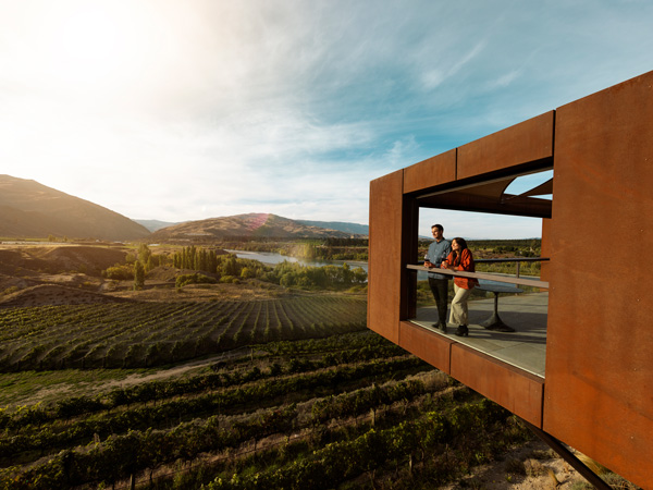 a couple sipping wine at Te Kano Estate, Central Otago