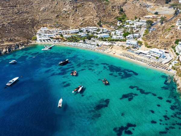 an aerial shot of the turquoise blue waters at Mykonos