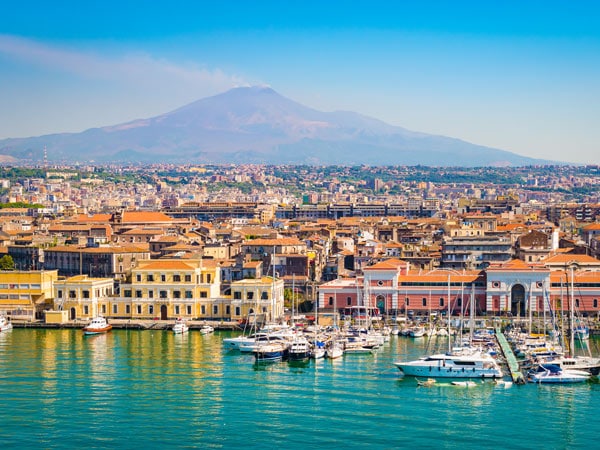 Catania with Mount Etna smoking in back