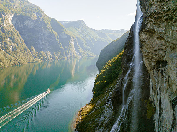 cruise ship near Seven sisters waterfall in Norway