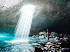 A man inside the Blue Cave on Tanna in Vanuatu