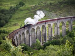 The Jacobite going over the Glenfinnan Viaduct in Scotland