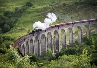 The Jacobite going over the Glenfinnan Viaduct in Scotland