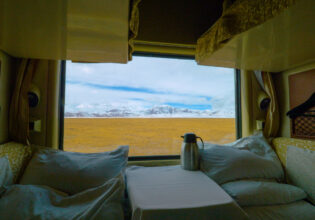 a sleeper train crossing the scenic Tibetan landscape