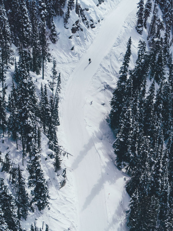 an aerial view of the snow-covered Blackcomb Mountain in Canada
