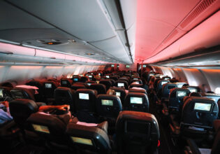 Chairs in aeroplane cabin with some reclined