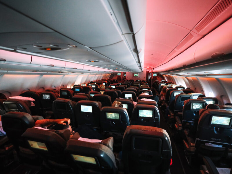 Chairs in aeroplane cabin with some reclined