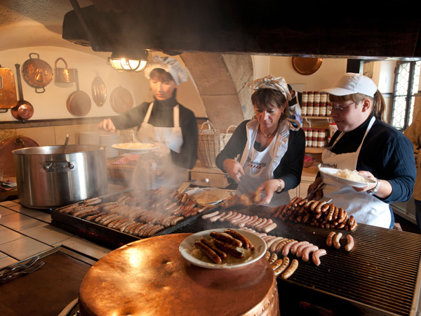 cooking Bavarian sausages at the sausage kitchen