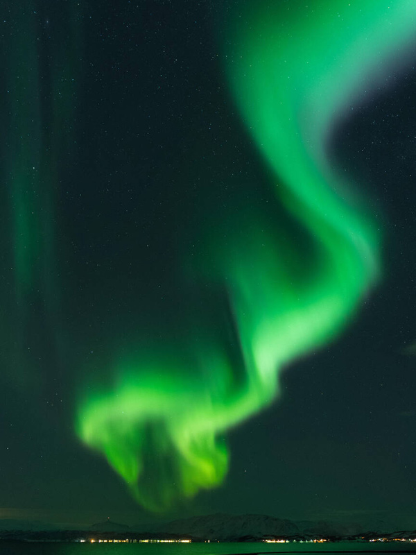 a close-up shot of the green lights in the sky, Aurora Borealis