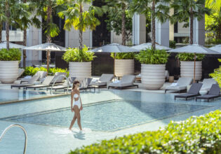 Woman in pool at Four Seasons Bangkok