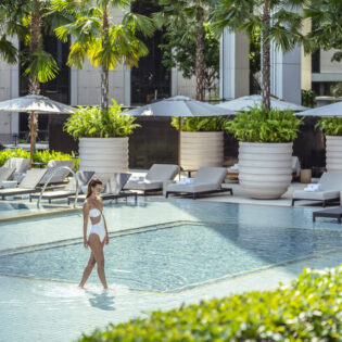 Woman in pool at Four Seasons Bangkok